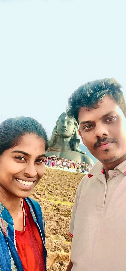 Kaviya and Prakash with Adiyogi in the background